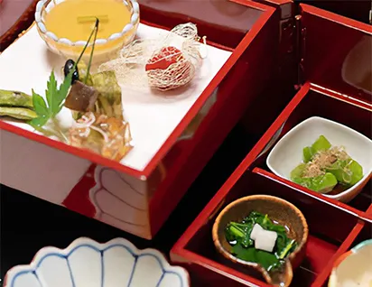 A beautifully arranged Japanese meal made with fresh local ingredients, showcasing the warmth of traditional hospitality.